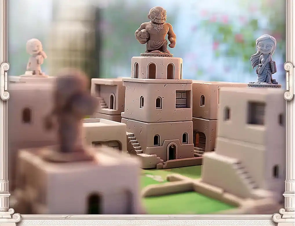 A close-up of the Santorini board game showing plastic building components and worker figures. A large, muscular worker figure stands atop a three-story tower in the center.