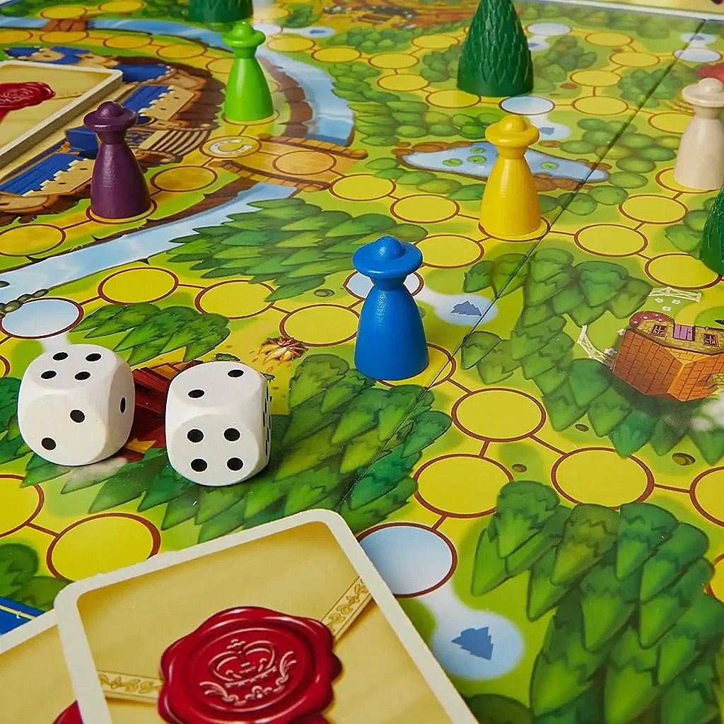 Enchanted Forest kids board game board setup with pieces, dice, and cards.