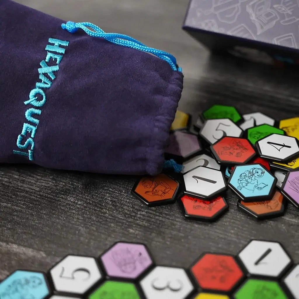 Close up of hexaquest hexagons and cloth bag for the classic trivia game