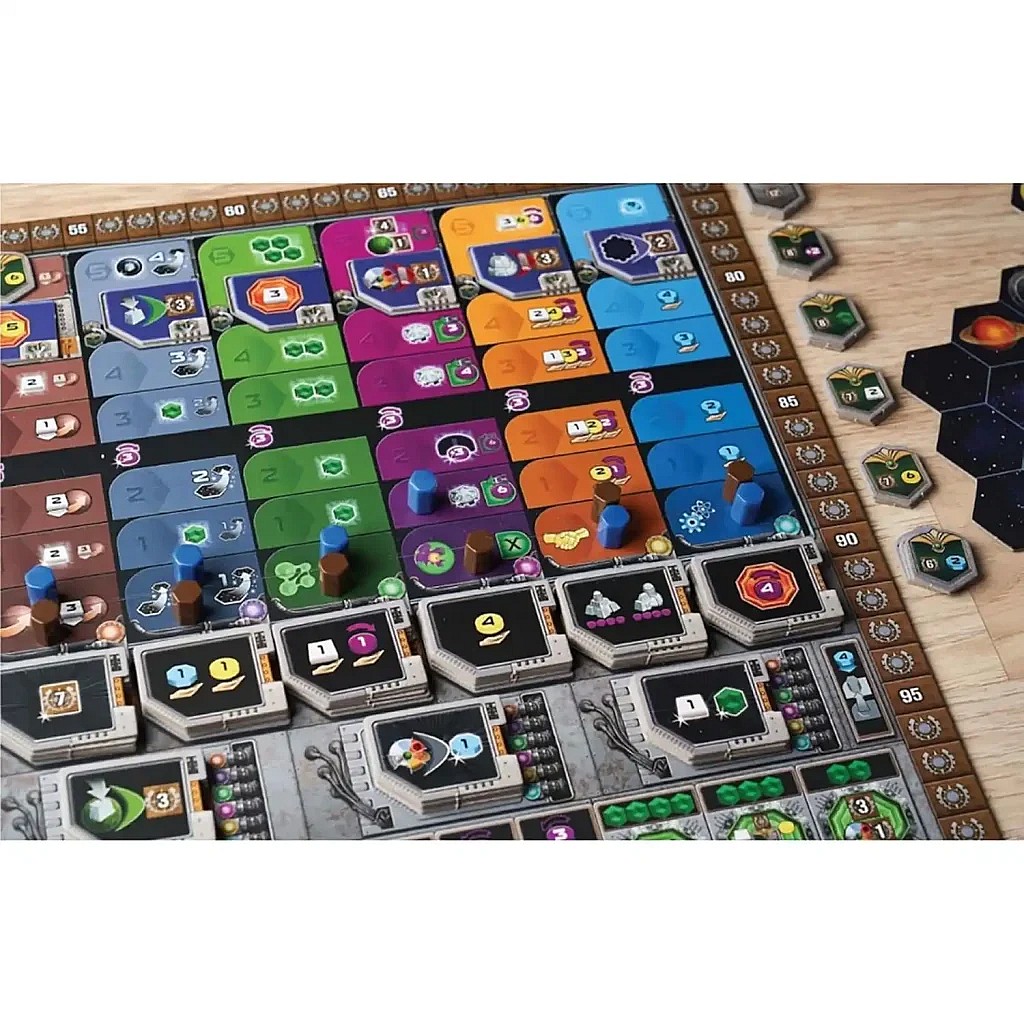 A close-up view of the Gaia Project game board in play, focusing on the main research and scoring tracks with various colored cubes, wooden tokens, and player pieces placed on the board, alongside several hexagonal tiles on a wooden table.