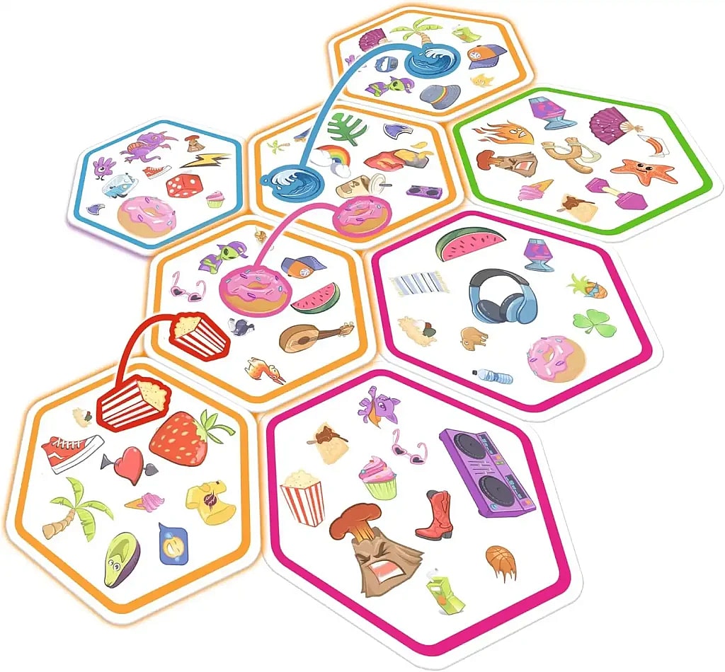 A photograph shows seven hexagonal game cards from Spot It! Connect arranged in a connected pattern on a white surface, demonstrating the "connect" aspect of the game. Each card has a different colored border (blue, orange, pink, purple, and green) and is filled with small, colorful, eclectic icons of objects like food (popcorn, watermelon, donuts, avocado), animals (dragon, octopus, seahorse), and various items (headphones, boombox, sunglasses, volcano). Colored lines with small suction-cup-like ends are overlaid on the cards, visually linking symbols that have been matched. For example, a red line connects a popcorn icon on one card to a popcorn icon on an adjacent card. This illustration highlights the objective of the game, which is to spot matching symbols and connect the cards.