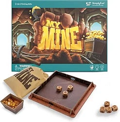 Board game box and components for "My Mine" by Reiner Knizia, featuring a gold mine theme with dice, a drawstring bag, and gold nuggets.