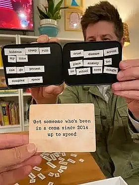 two friends playing the card game ransom notes and showing a close up of a question card and two answer cards